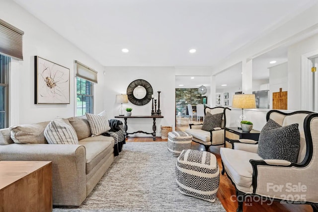 living room with recessed lighting and wood finished floors