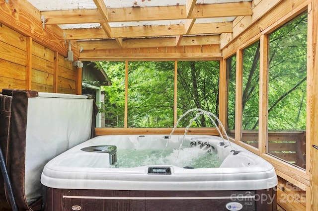 unfurnished sunroom with a jacuzzi