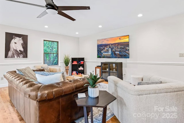 living room featuring light wood-style flooring, recessed lighting, baseboards, and ceiling fan