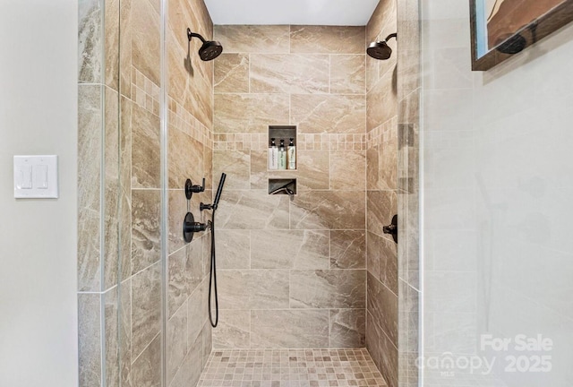 full bath featuring a tile shower