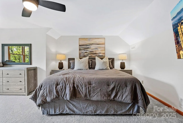 bedroom featuring visible vents, lofted ceiling, carpet flooring, baseboards, and ceiling fan