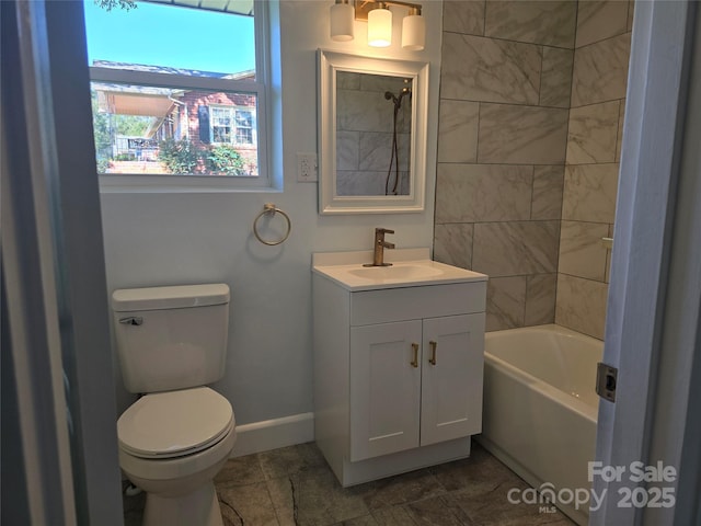 bathroom featuring baseboards, toilet, vanity, and shower / tub combination