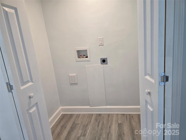 washroom with baseboards, washer hookup, laundry area, wood finished floors, and hookup for an electric dryer