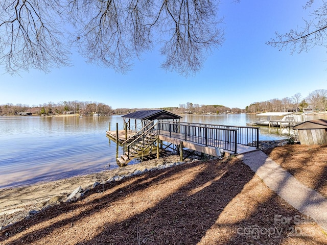 dock area with a water view