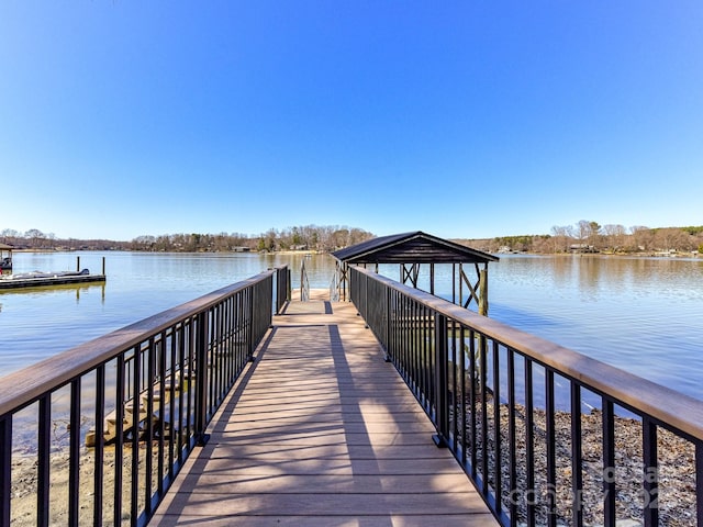 dock area featuring a water view