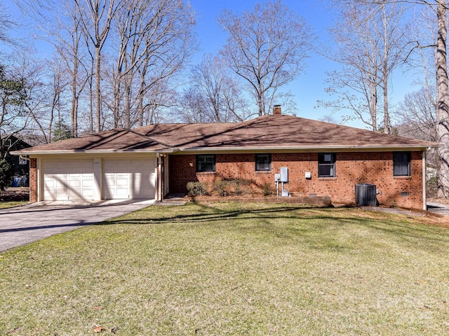 ranch-style house with aphalt driveway, a garage, brick siding, and a front yard