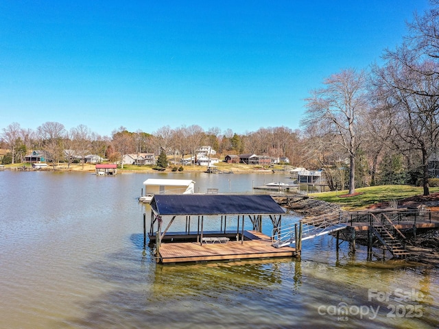 view of dock featuring a water view and boat lift