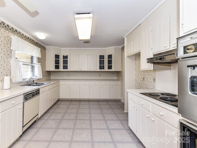 kitchen featuring a sink, under cabinet range hood, electric stovetop, light floors, and dishwasher