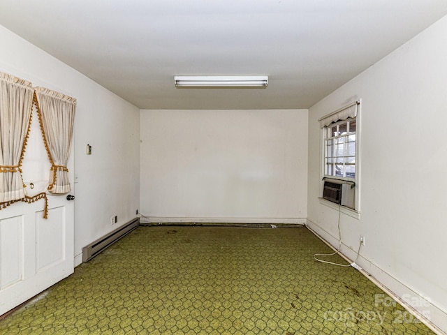 unfurnished room with cooling unit and a baseboard radiator