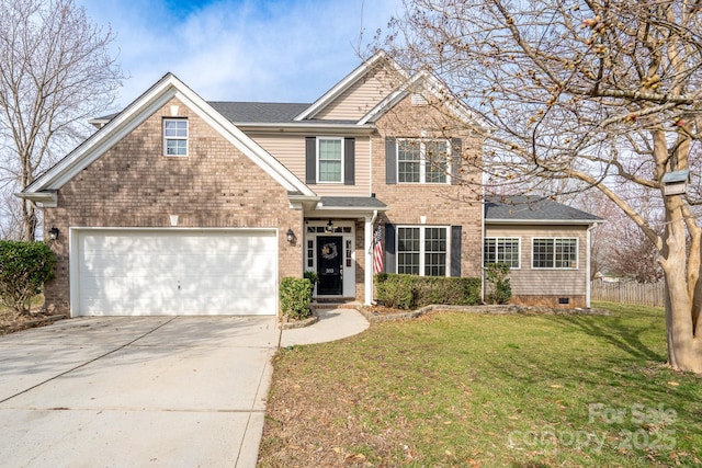 view of front of house featuring a front yard, fence, driveway, a garage, and brick siding