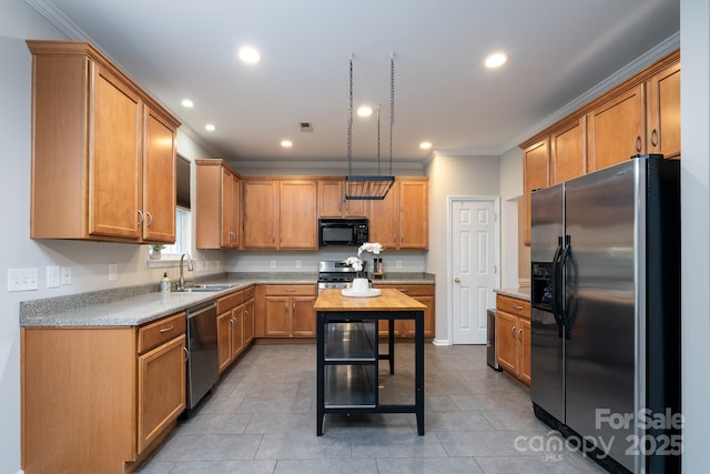 kitchen with recessed lighting, a sink, ornamental molding, light countertops, and stainless steel appliances