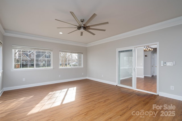 unfurnished bedroom featuring baseboards, wood finished floors, a ceiling fan, and ornamental molding