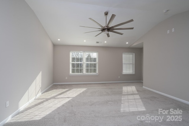 unfurnished room with light carpet, lofted ceiling, recessed lighting, baseboards, and ceiling fan