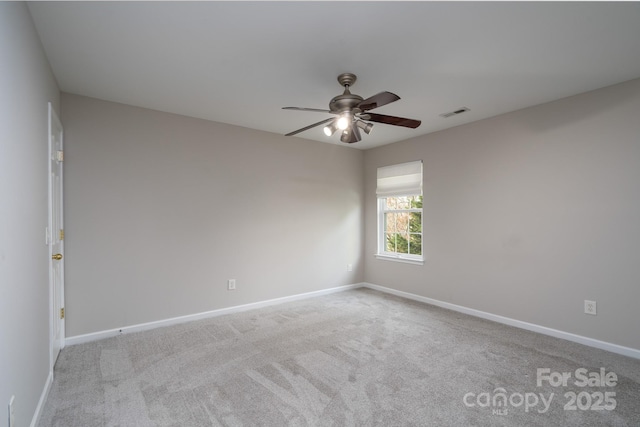 unfurnished room featuring carpet flooring, baseboards, and ceiling fan