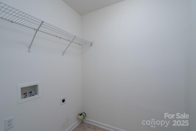 clothes washing area featuring electric dryer hookup, baseboards, hookup for a washing machine, and laundry area