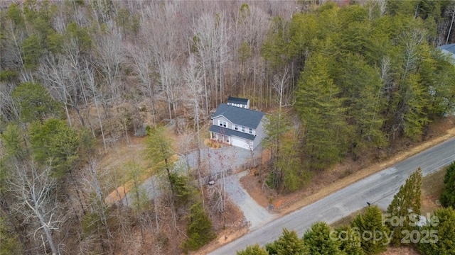 aerial view featuring a forest view