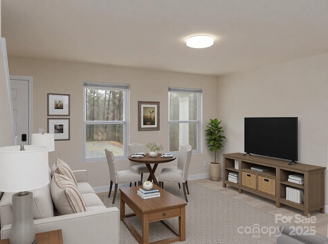 living room featuring baseboards and light wood-style flooring