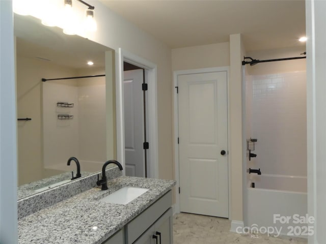 full bath featuring vanity and bathing tub / shower combination