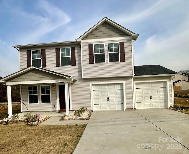 view of front of house with concrete driveway, a porch, and a garage