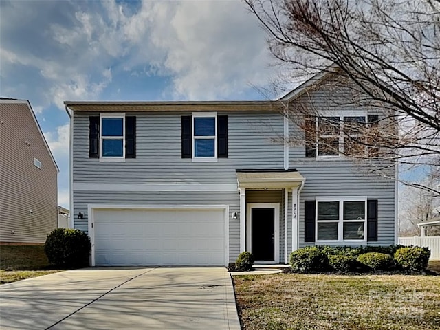 view of front facade featuring a garage, concrete driveway, and fence