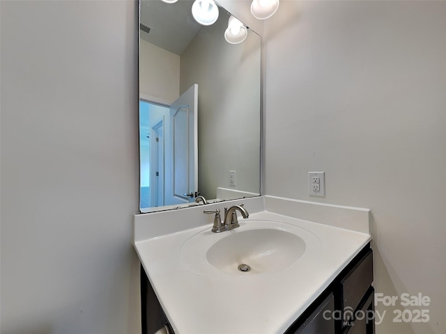 bathroom with visible vents and vanity