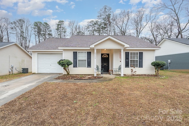 ranch-style house with a garage, roof with shingles, concrete driveway, and a front yard