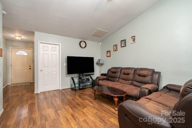 living area featuring wood finished floors and baseboards