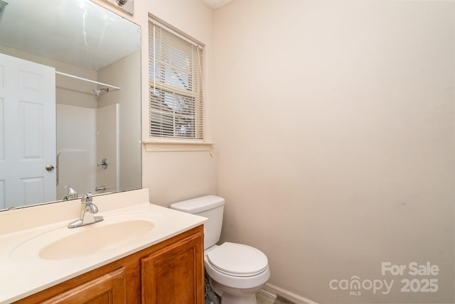 full bath featuring vanity, toilet, and a shower