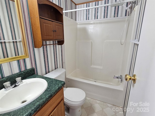 full bath with tub / shower combination, toilet, vanity, and wallpapered walls