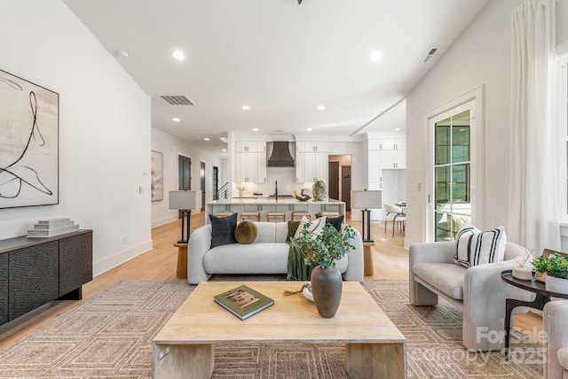 2021 S St, Charlotte, NC 28208 - living area with light wood-style floors, recessed lighting, and baseboards
