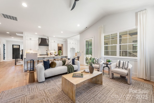 2021 S St, Charlotte, NC 28208 - living room featuring recessed lighting, light wood-style floors, vaulted ceiling, ceiling fan, and baseboards