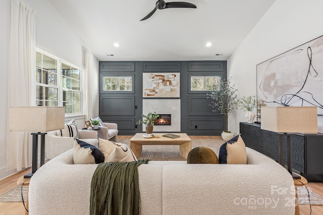 2021 S St, Charlotte, NC 28208 - living room featuring healthy amount of natural light, wood finished floors, ceiling fan, a high end fireplace, and recessed lighting