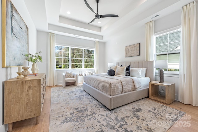 2021 S St, Charlotte, NC 28208 - bedroom featuring wood finished floors, a raised ceiling, recessed lighting, and ceiling fan