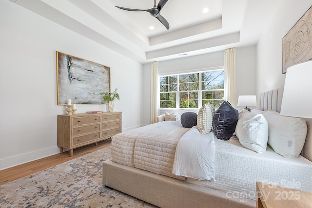 2021 S St, Charlotte, NC 28208 - bedroom with wood finished floors, baseboards, recessed lighting, a ceiling fan, and a raised ceiling