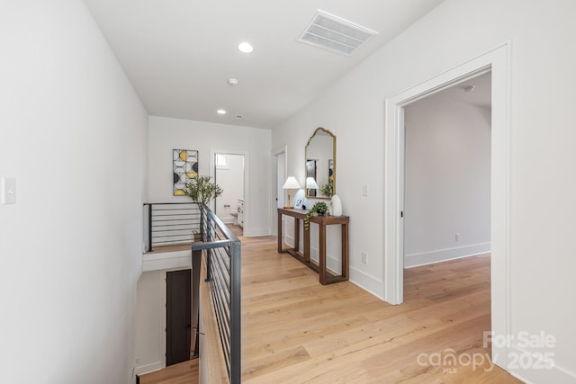 2021 S St, Charlotte, NC 28208 - corridor with light wood-type flooring, recessed lighting, baseboards, and an upstairs landing