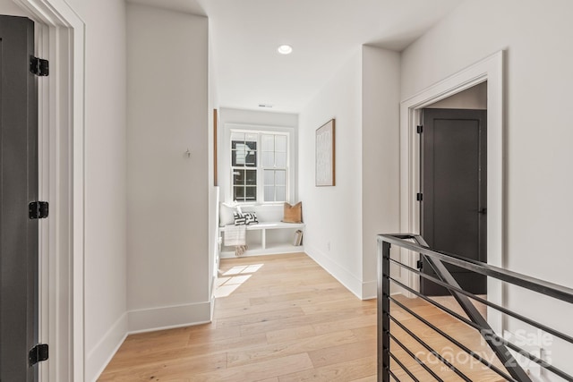 2021 S St, Charlotte, NC 28208 - corridor with light wood finished floors, baseboards, an upstairs landing, and recessed lighting