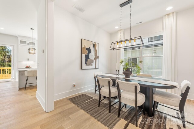2013 S St, Charlotte, NC 28208 - dining room featuring light wood finished floors, baseboards, and recessed lighting