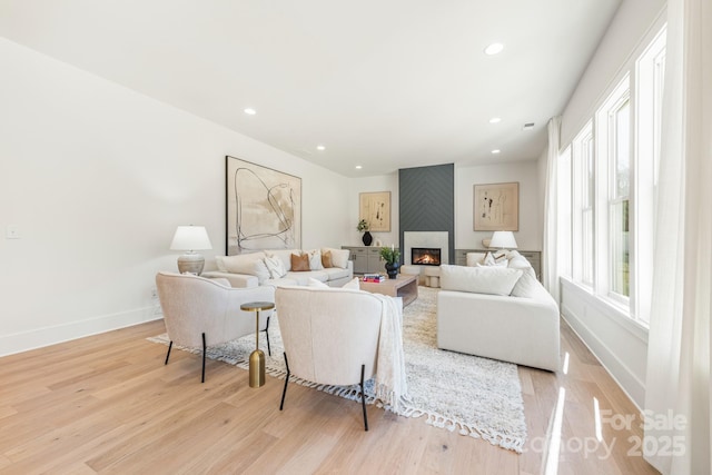 2013 S St, Charlotte, NC 28208 - living area featuring a fireplace, light wood-type flooring, baseboards, and recessed lighting
