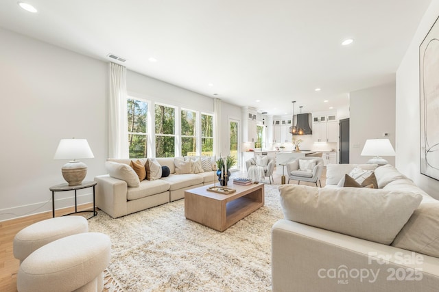2013 S St, Charlotte, NC 28208 - living room featuring recessed lighting and wood finished floors