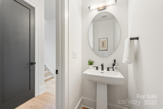 2013 S St, Charlotte, NC 28208 - bathroom with wood finished floors and baseboards