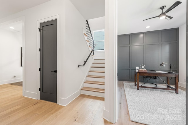 2013 S St, Charlotte, NC 28208 - stairway with wood finished floors, a ceiling fan, a decorative wall, baseboards, and recessed lighting
