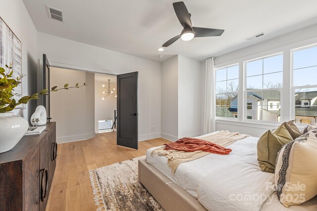 2013 S St, Charlotte, NC 28208 - bedroom with light wood-style floors, multiple windows, baseboards, recessed lighting, and ceiling fan