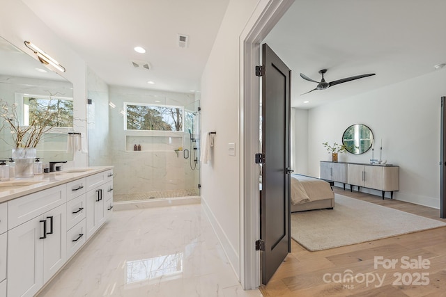 2013 S St, Charlotte, NC 28208 - ensuite bathroom featuring vanity, a marble finish shower, a ceiling fan, plenty of natural light, and recessed lighting