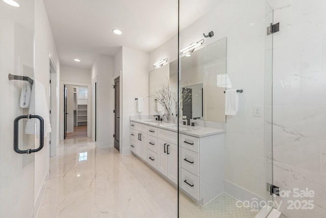 2013 S St, Charlotte, NC 28208 - bathroom featuring double vanity, marble tiled floors, a shower stall, recessed lighting, and baseboards