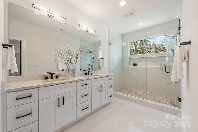 2013 S St, Charlotte, NC 28208 - full bathroom with marble look tile flooring, a marble finish shower, double vanity, and recessed lighting