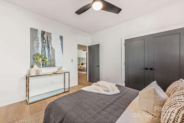 2013 S St, Charlotte, NC 28208 - bedroom with light wood-type flooring, baseboards, a closet, and ceiling fan