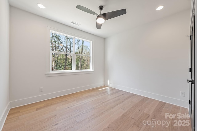 2013 S St, Charlotte, NC 28208 - empty room featuring a ceiling fan, light wood finished floors, baseboards, and recessed lighting