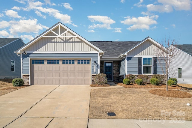 craftsman inspired home featuring stone siding, board and batten siding, concrete driveway, and an attached garage