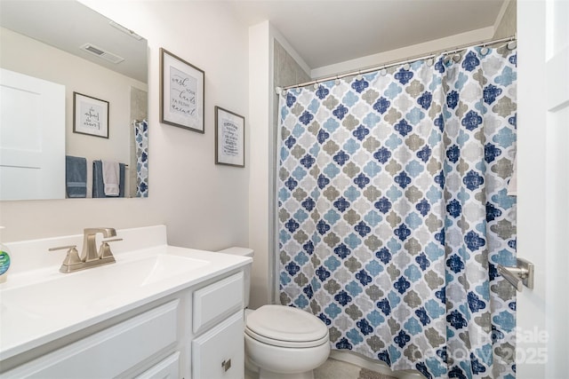 bathroom featuring vanity, a shower with shower curtain, toilet, and visible vents