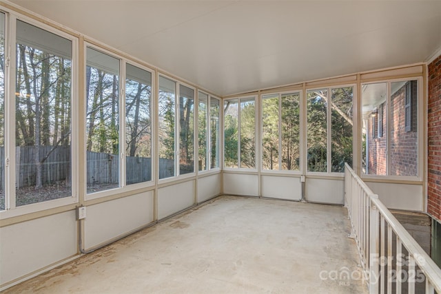 unfurnished sunroom featuring a wealth of natural light